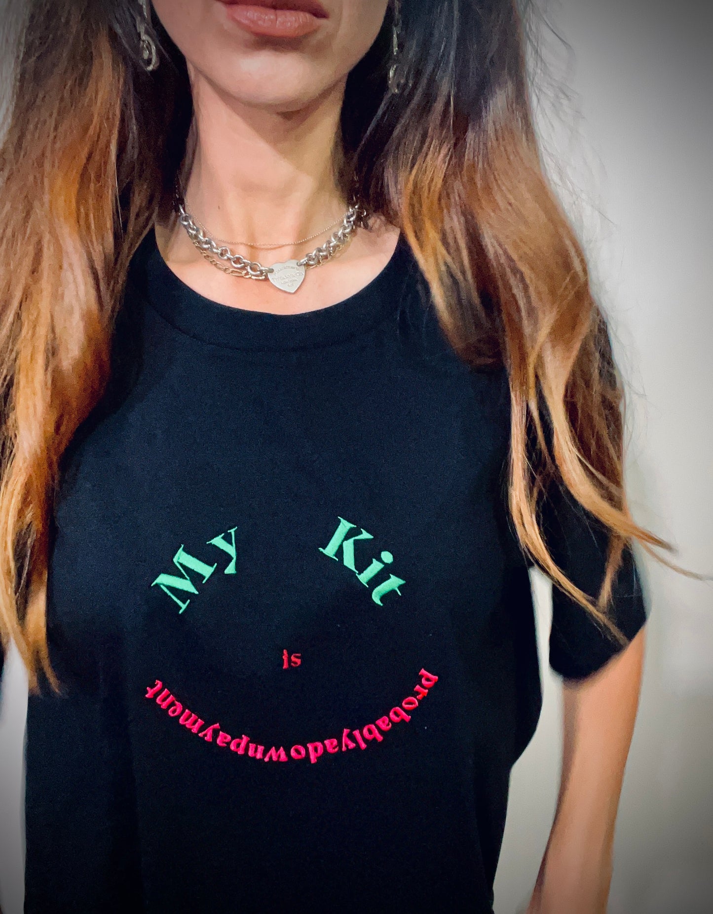 My Kit Is Probably A Downpayment ~ 100% organic cotton Tee ~ black ~ relaxed fit ~ gender neutral ~ embroided green, red & pink smile design
